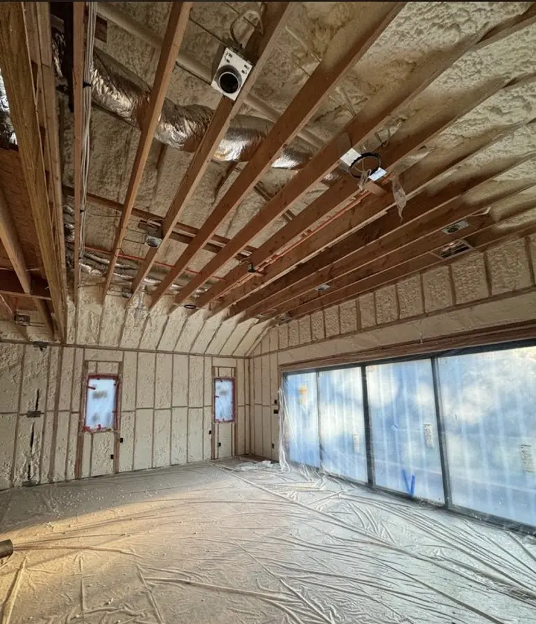 Interior walls and ceiling insulated with spray foam during new construction in North Vernon